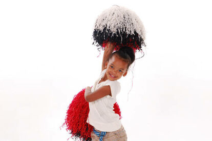 A four year old girl cheering A four year old girl cheering